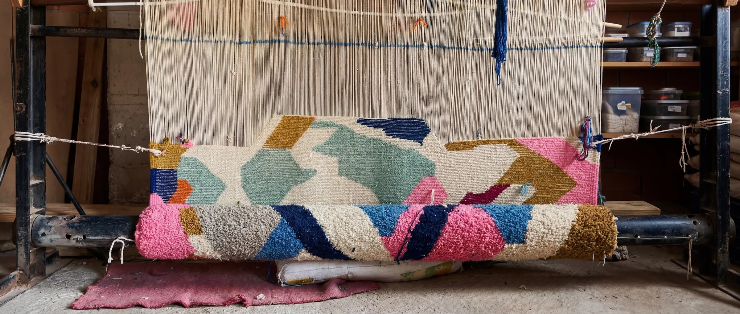 Colourful rug being woven on a traditional loom in Morocco